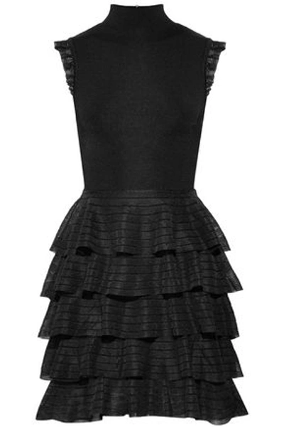 Shop Alice And Olivia Janice Tiered Stretch-knit Turtleneck Mini Dress In Black