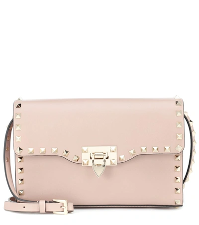 Shop Valentino Garavani Rockstud Medium Leather Shoulder Bag In Pink