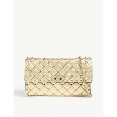 Shop Valentino Rockstud Spike Quilted Clutch In Gold