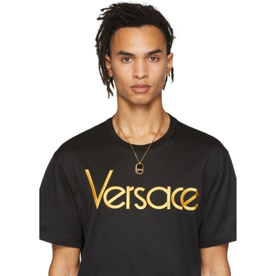 Shop Versace Gold Varsity Dog Tag Necklace In K41t Go/blk