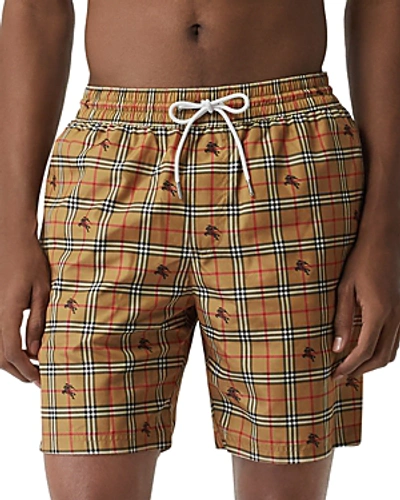 Shop Burberry Guildes Equestrian Knight Check-print Swim Shorts In Camel