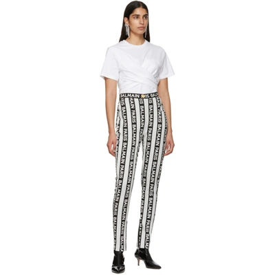 Shop Balmain Black And White Stripe Logo Trousers In Eab Blk/wht