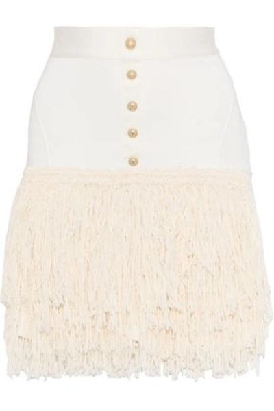 Shop Balmain Woman Button-embellished Fringed Stretch-knit Mini Skirt Ecru