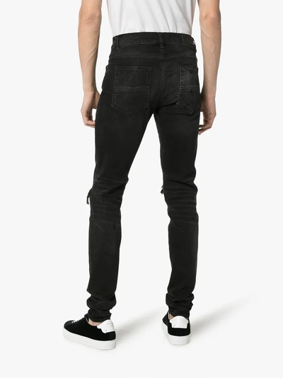 Shop Amiri Repair Distressed Slim Fit Denim Jeans In 101 - Black