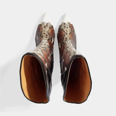 Shop Ganni | Zoey Western Python Print Boots In Black And Brown Snake Embossed Calfskin