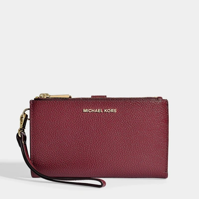 Shop Michael Michael Kors | Double Zip Wristlet In Oxblood Grained Calfskin