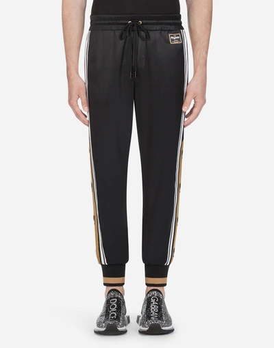 Shop Dolce & Gabbana Satin Jogging Pants With Patch In Black