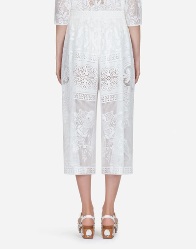 Shop Dolce & Gabbana Lace Pants In White