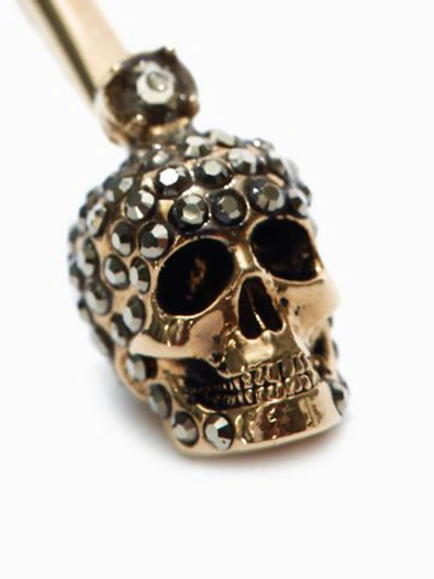 Shop Alexander Mcqueen Stick Skull Earrings In Gold