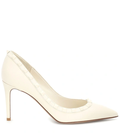Shop Valentino Rockstud Leather Pumps In White