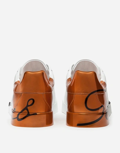 Shop Dolce & Gabbana Metallic Patent Calfskin Portofino Sneakers In White/bronze
