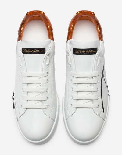 Shop Dolce & Gabbana Metallic Patent Calfskin Portofino Sneakers In White/bronze