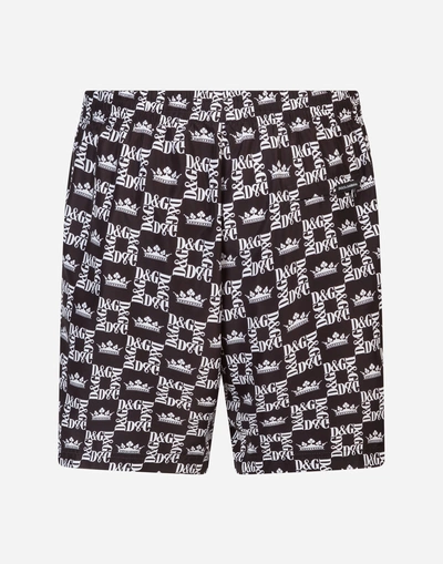 Shop Dolce & Gabbana Mid Swimming Trunks With Crown Print And Pouch Bag In Black