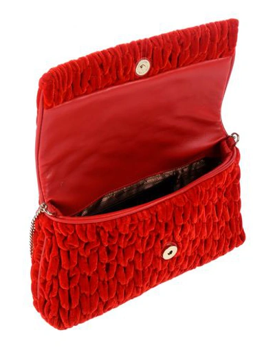 Shop Love Moschino Cross-body Bags In Red