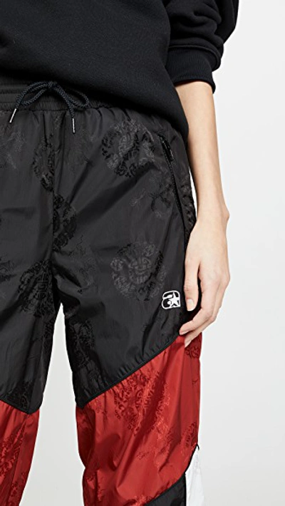 Shop Alexander Wang Winbreaker Track Pants With Elastic Waistband In Black/white/red