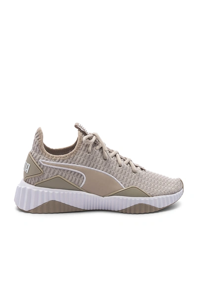Shop Puma Defy Sneaker In Gray. In Silver Gray &  White