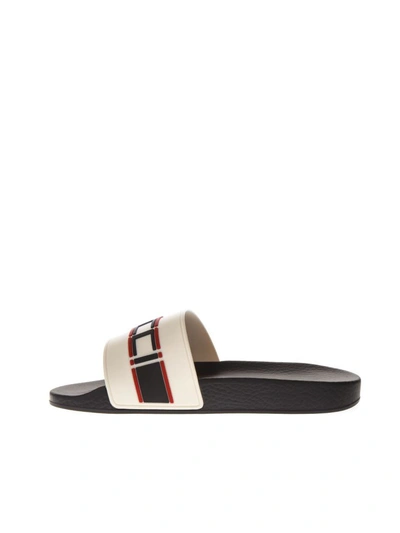 Shop Gucci Beige Rubber Slide Sandals With Embossed  Logo