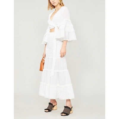 Shop Alexis Godiva Fringed Flared-sleeve Stretch-cotton Wrap Top In White