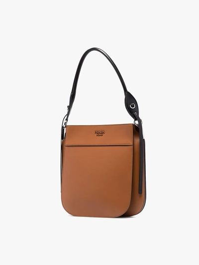 Shop Prada Grosse 'margit' Umhängetasche In Cognac/nero