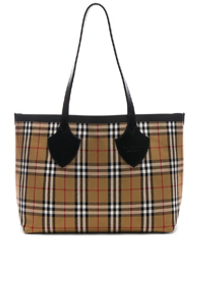 Shop Burberry Reversible Vintage Check Tote In Yellow & Bright Red