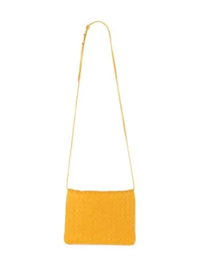 Shop Bottega Veneta Leather Messenger Bag In Marigold