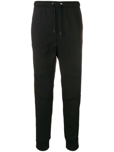 Shop Fendi Ff-logo Tapered Track Trousers In Black
