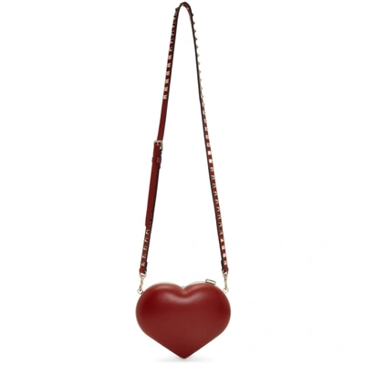 Shop Valentino Red  Garavani Rockstud Carry Secrets Heart Minaudiere Bag In 0ro Red