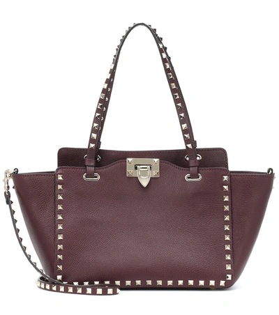 Shop Valentino Rockstud Small Leather Tote In Red