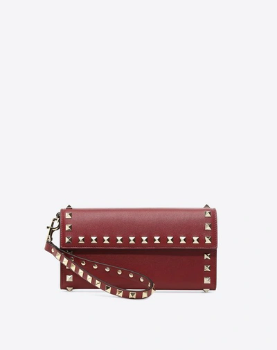 Shop Valentino Garavani Continental Rockstud Wallet In Rubin