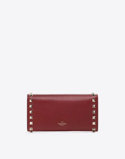 Shop Valentino Garavani Continental Rockstud Wallet In Rubin