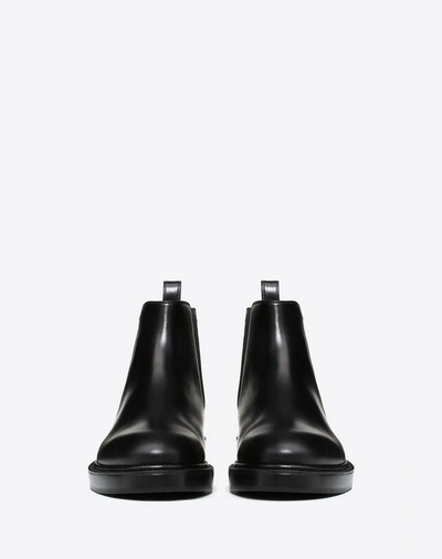 Shop Valentino Garavani Uomo Vltn Brush-off Calfskin Beatle Boots In Black