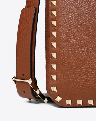 Shop Valentino Garavani Small Grain Calfskin Leather Rockstud Hobo Bag In Brown