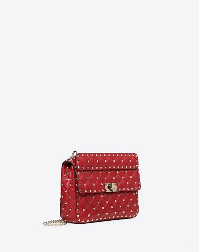 Shop Valentino Garavani Medium Rockstud Spike Nappa Leather Bag In Rosso