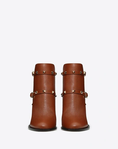 Shop Valentino Garavani Grain Calfskin Leather Rockstud Bootie 100mm In Brown