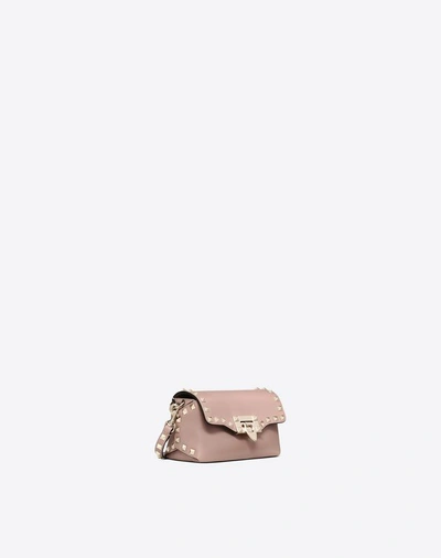 Shop Valentino Garavani Mini Rockstud Calfskin Crossbody Bag In Poudre