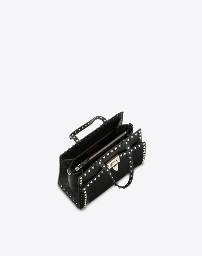 Shop Valentino Small Rockstud Top Handle Bag In Black