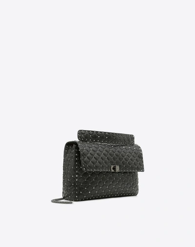 Shop Valentino Garavani Maxi Crinkled Lambskin Rockstud Noir Spike Bag In Black
