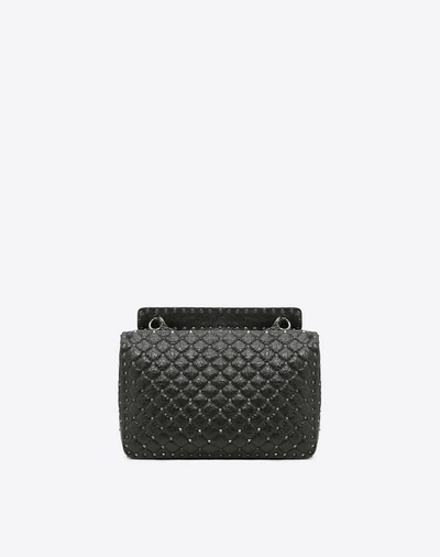 Shop Valentino Garavani Maxi Crinkled Lambskin Rockstud Noir Spike Bag In Black