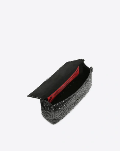 Shop Valentino Garavani Maxi Crinkled Lambskin Rockstud Noir Spike Bag In Black