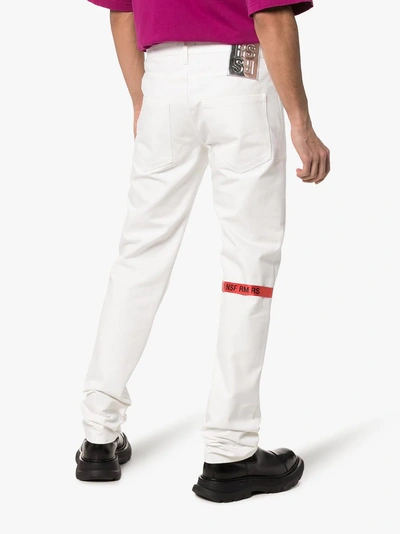 Shop Raf Simons Straight Leg Logo Patch Jeans In White