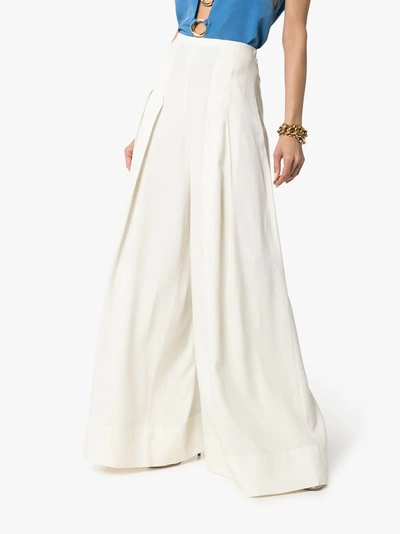 Shop Jacquemus High-waisted Wide Leg Pleated Trousers In White