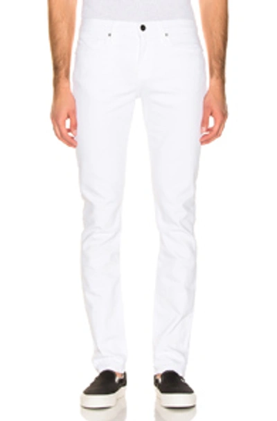 Shop Frame Slim Jeans In White