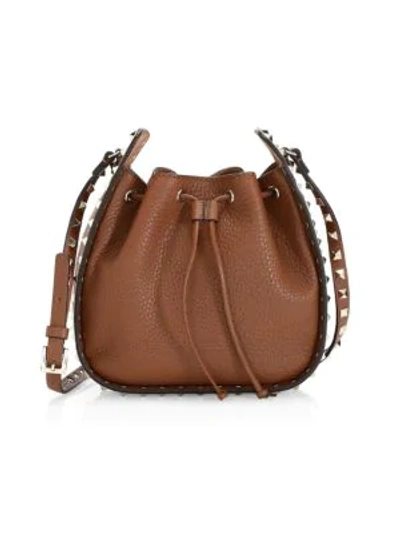 Shop Valentino Small Rockstud Leather Bucket Bag In Cognac