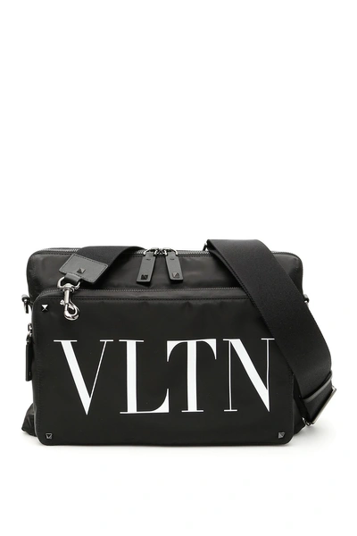 Shop Valentino Vltn Messenger Bag In Nero Bianco|nero
