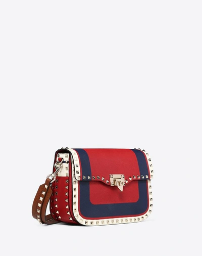 Shop Valentino Medium Inlayed Rockstud Crossbody Bag In Red