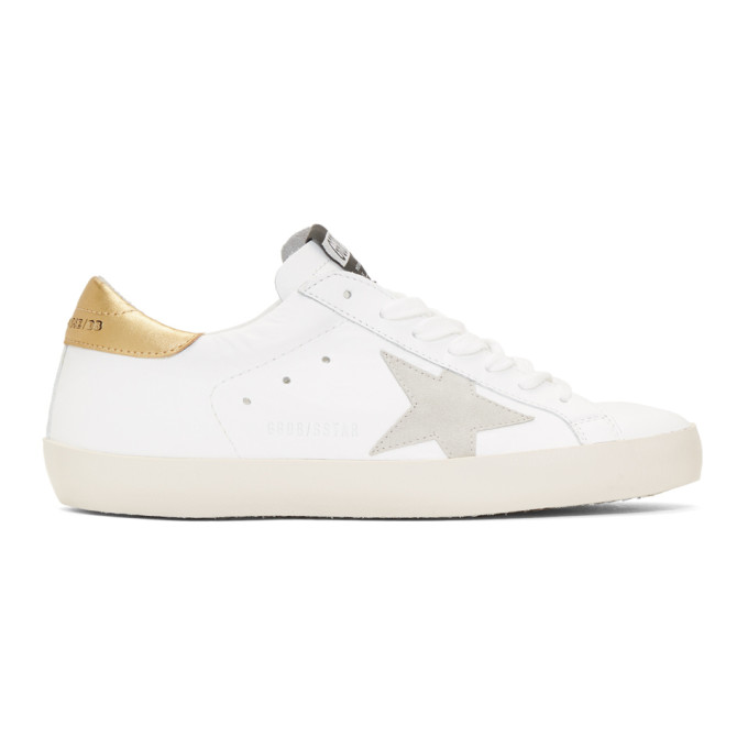 golden goose white & gold superstar sneakers