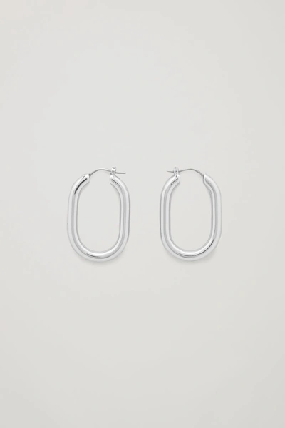 Shop Cos Oval Hoop Earrings In Silver