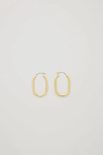 Shop Cos Oval Hoop Earrings In Gold
