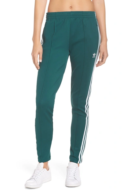 Shop Adidas Originals Adidas Sst Track Pants In Collegiate Green