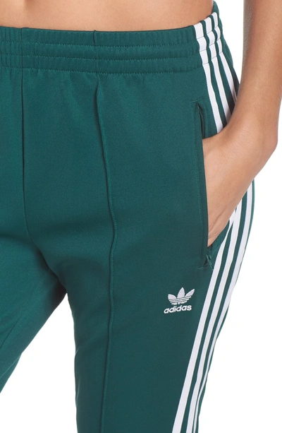 Shop Adidas Originals Adidas Sst Track Pants In Collegiate Green